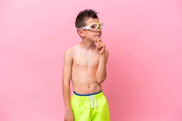 Little Caucasian Boy Wearing Diving Goggles Isolated Pink Background Looking — 스톡 사진