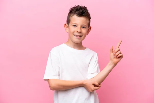 Little Caucasian Boy Isolated Pink Background Happy Pointing — Stok fotoğraf