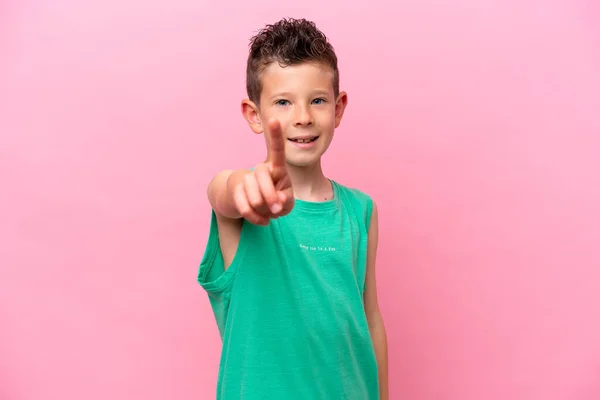 Little Caucasian Boy Isolated Pink Background Showing Lifting Finger —  Fotos de Stock