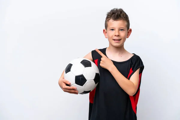 Little Caucasian Boy Isolated White Background Soccer Ball Pointing Lateral — Stockfoto