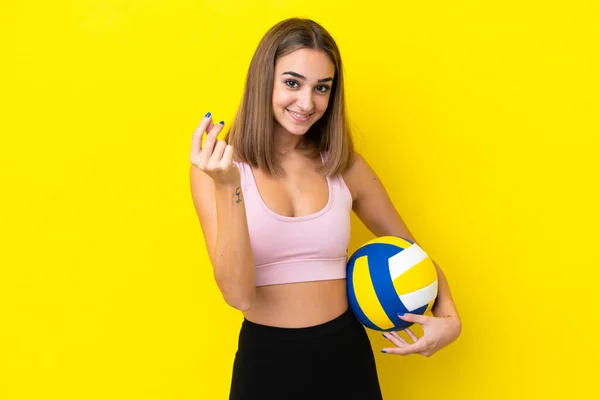 Young Woman Playing Volleyball Isolated Yellow Background Making Money Gesture — Fotografia de Stock