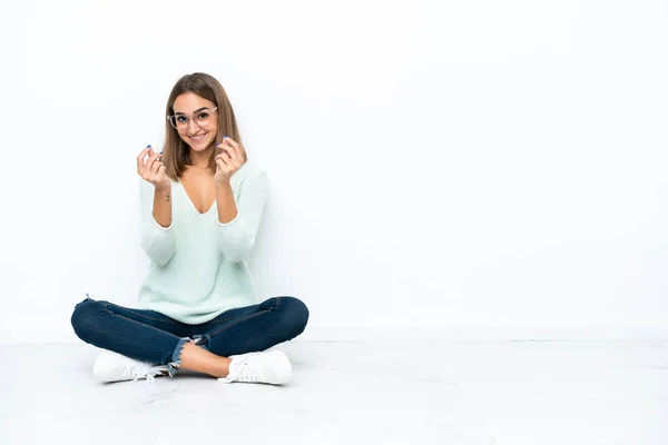 Young Caucasian Woman Sitting Floor Isolated White Background Making Money — Foto de Stock