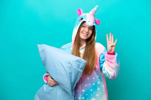 Young Caucasian Girl Unicorn Pajamas Holding Pillow Isolated Blue Background — Stock Photo, Image