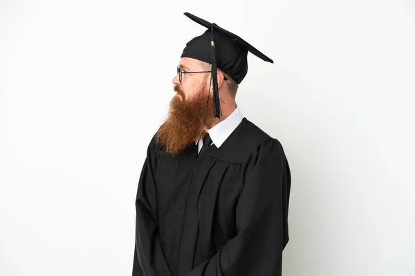 Young University Graduate Reddish Man Isolated White Background Looking Side — ストック写真