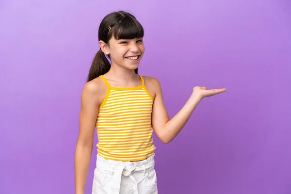 Little Caucasian Kid Isolated Purple Background Holding Copyspace Imaginary Palm — Foto Stock