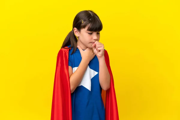 Little super hero kid isolated on purple background is suffering with cough and feeling bad