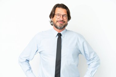 Senior dutch business man isolated on white background posing with arms at hip and smiling