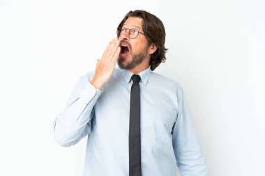 Senior dutch business man isolated on white background yawning and covering wide open mouth with hand