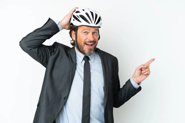 Business Senior Man Bike Helmet Isolated White Background Surprised Pointing — Stockfoto