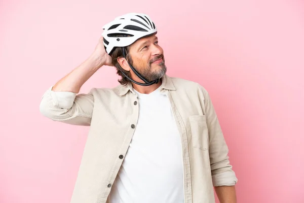 Senior Dutch Man Bike Helmet Isolated Pink Background Thinking Idea — Fotografia de Stock