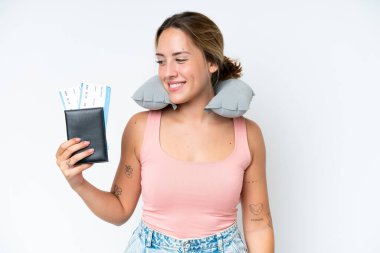 Woman with Inflatable Travel Pillow over isolated background looking side