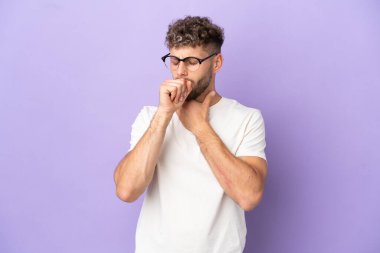 Delivery caucasian man isolated on purple background coughing a lot