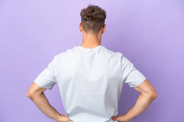 Delivery Caucasian Man Isolated Purple Background Back Position — Stock Fotó