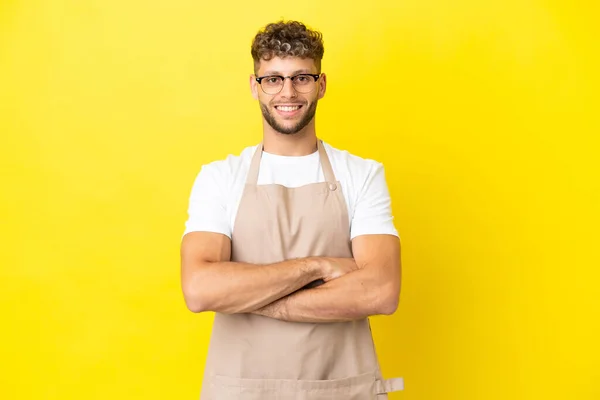 Restaurant Waiter Blonde Man Isolated Yellow Background Keeping Arms Crossed — ストック写真