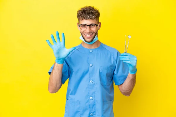 Dentist Blonde Man Holding Tools Isolated Background Counting Five Fingers — Fotografia de Stock