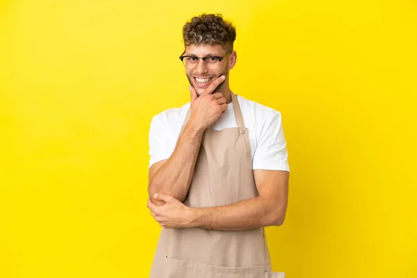 Restaurant Waiter Blonde Man Isolated Yellow Background Smiling — ストック写真