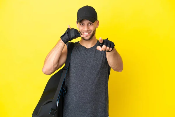 Young Sport Blonde Man Sport Bag Isolated Yellow Background Making —  Fotos de Stock