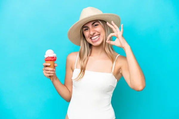 Young Caucasian Woman Swimsuit Cornet Ice Cream Isolated Blue Background — Stockfoto