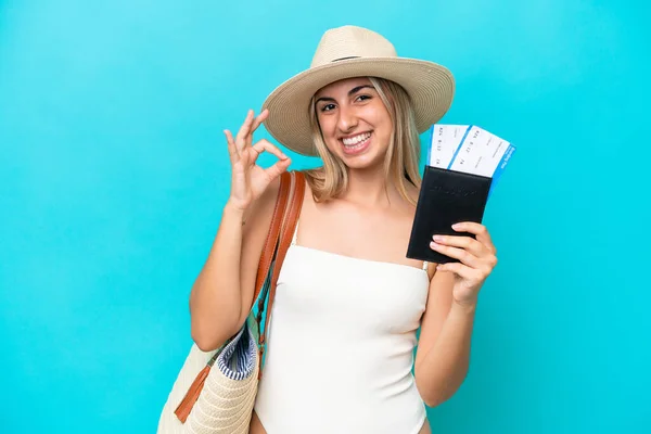 Young Caucasian Woman Swimsuit Holding Passport Isolated Blue Background Showing — Stockfoto