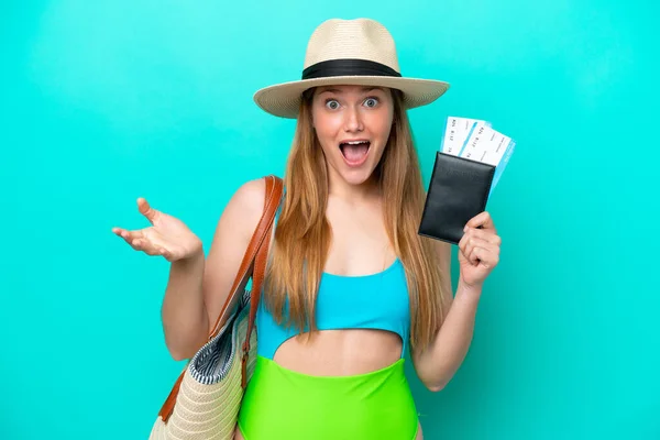 Traveler Caucasian Woman Holding Passport Isolated Blue Background Shocked Facial — Stock Fotó