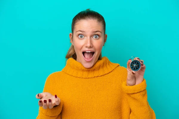 Young Caucasian Woman Holding Compass Isolated Blue Background Shocked Facial — 图库照片