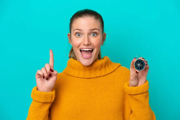 Young Caucasian Woman Holding Compass Isolated Blue Background Pointing Great — Stockfoto