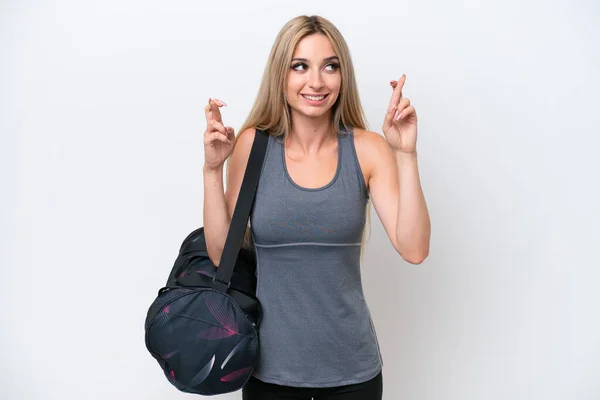 Young Sport Woman Sport Bag Isolated White Background Fingers Crossing — Stok fotoğraf