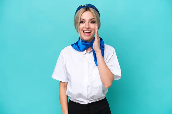 Airplane Blonde Stewardess Woman Isolated Blue Background Surprise Shocked Facial — Stock Photo, Image