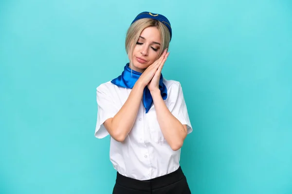 Airplane Blonde Stewardess Woman Isolated Blue Background Making Sleep Gesture — Stockfoto
