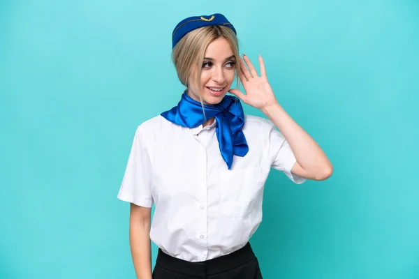Airplane Blonde Stewardess Woman Isolated Blue Background Listening Something Putting — Stock Photo, Image