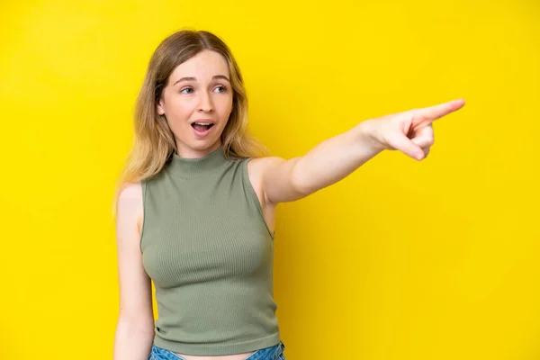 Blonde English Young Girl Isolated Yellow Background Pointing Away — Stock Fotó