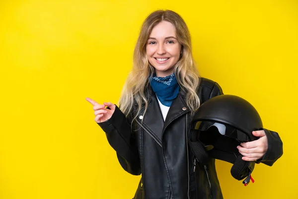 Blonde English Young Girl Motorcycle Helmet Isolated Yellow Background Pointing — Zdjęcie stockowe