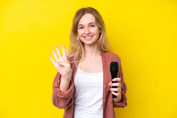 Young Singer Caucasian Woman Picking Microphone Isolated Yellow Background Happy — Fotografia de Stock