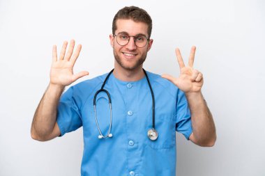 Young surgeon doctor caucasian man isolated on white background counting eight with fingers