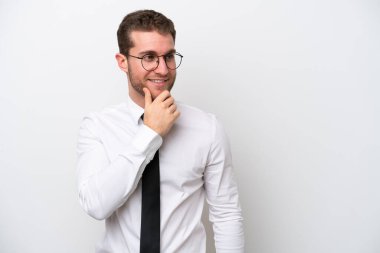 Young business caucasian man isolated on white background looking to the side