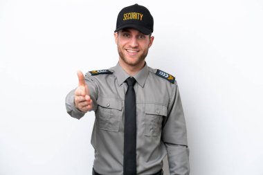 Young safeguard caucasian man isolated on white background shaking hands for closing a good deal