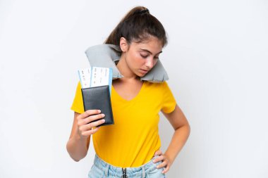 Young caucasian woman with Inflatable travel pillowisolated on white background suffering from backache for having made an effort 