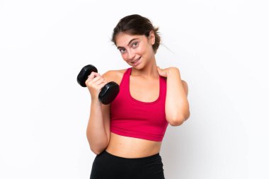 Young sport caucasian woman making weightlifting isolated on white background laughing