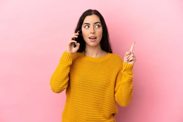 Young Caucasian Woman Using Mobile Phone Isolated Pink Background Thinking — Stock fotografie