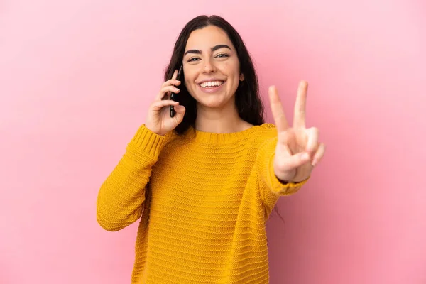 Young Caucasian Woman Using Mobile Phone Isolated Pink Background Smiling — Foto de Stock