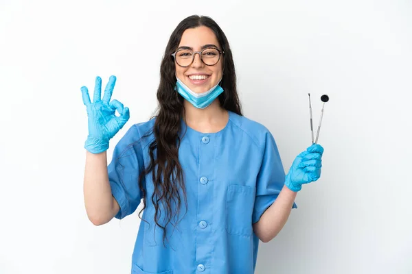 Young Woman Dentist Holding Tools Isolated White Background Showing Sign — 图库照片