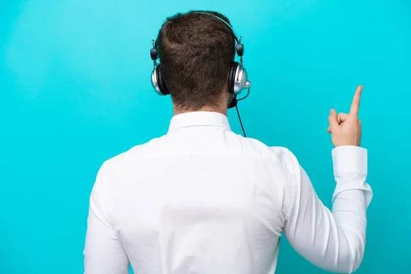 Telemarketer Caucasian Man Working Headset Isolated Blue Background Pointing Back — Fotografia de Stock