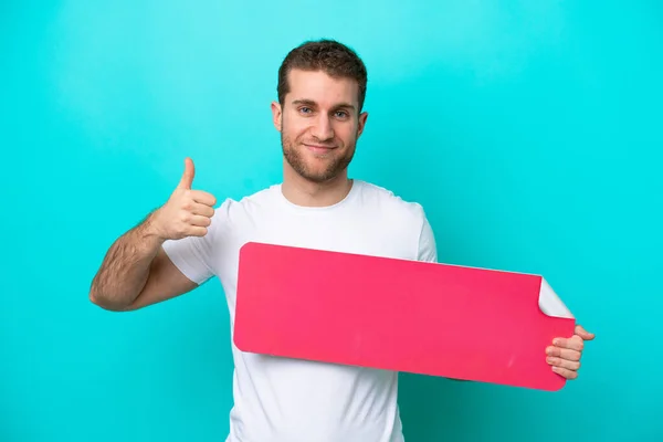 Young Caucasian Man Isolated Blue Background Holding Empty Placard Thumb — Foto Stock