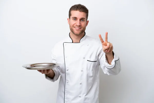 Young Caucasian Chef Tray Isolated White Background Smiling Showing Victory — Zdjęcie stockowe