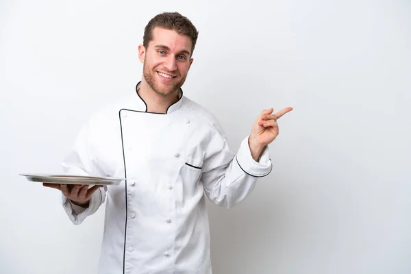 Young Caucasian Chef Tray Isolated White Background Pointing Finger Side — Photo
