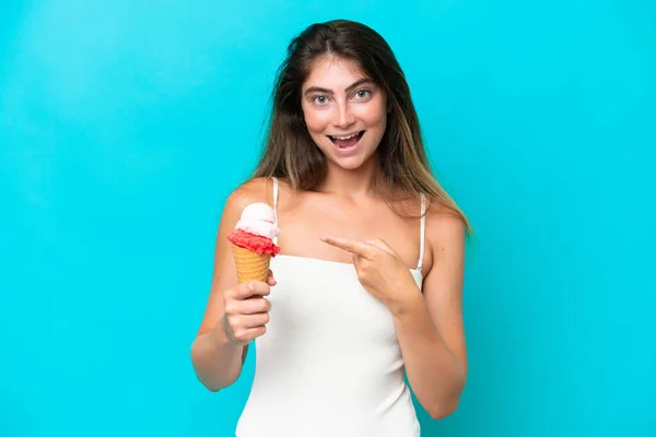 Young Woman Swimsuit Holding Ice Cream Isolated Blue Background Pointing — ストック写真