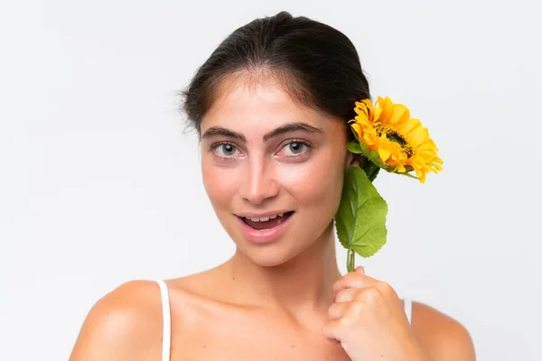 Young Pretty Caucasian Woman Isolated White Background Holding Sunflower While — Zdjęcie stockowe