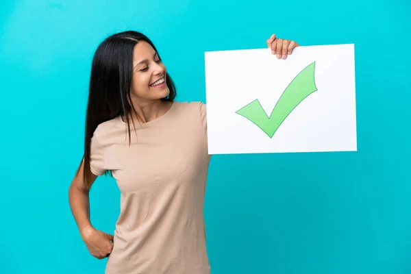 Young Woman Isolated Background Holding Placard Text Green Check Mark — Stockfoto