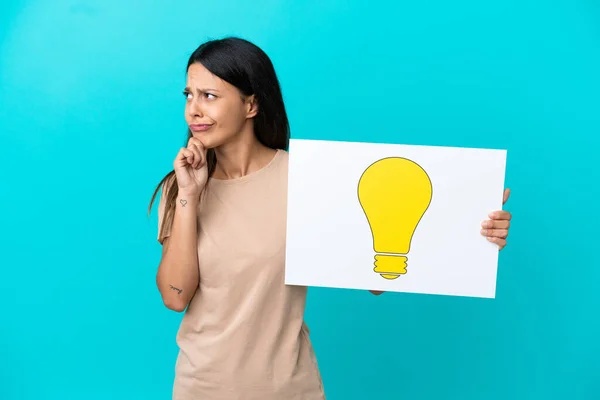 Young Woman Isolated Background Holding Placard Bulb Icon Thinking — Stock Photo, Image