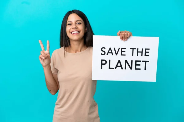 Young Woman Isolated Background Holding Placard Text Planet Celebrating Victory — Foto de Stock